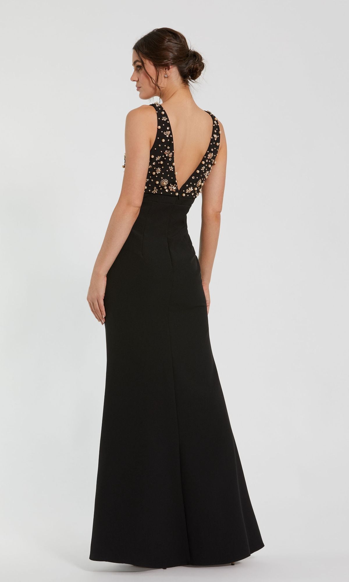 A woman models the Beaded-Bodice Long Prom Dress: Mac Duggal 2278, featuring an elegant empire waist and floral embellishments, against a plain white background.